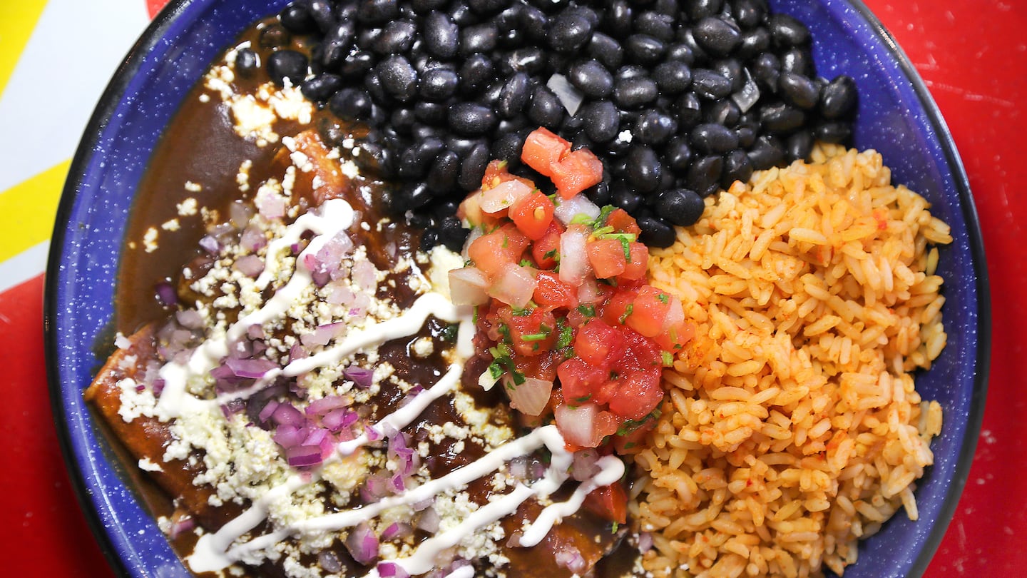 Enchilada mole with rice and black beans at Tenoch, which just opened in Harvard Square.