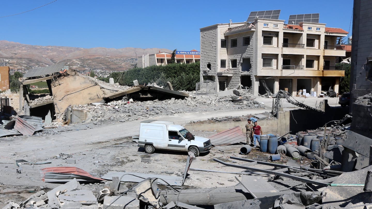 People check the destruction at the site of an Israeli overnight airstrike that targeted a house in the town of Ablah in Lebanon's Bekaa valley on Oct. 5.