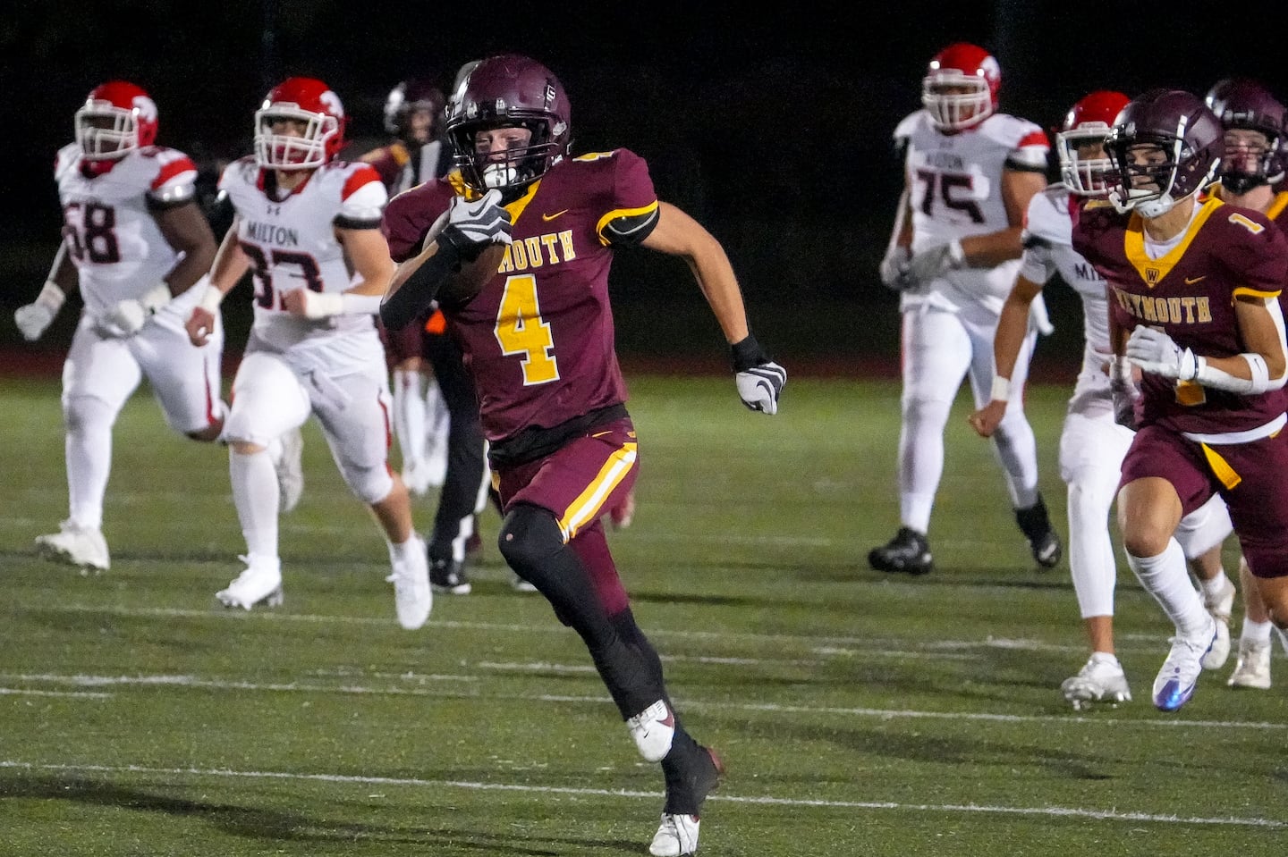 Weymouth’s Tyler Munchbach (4) breaks loose for an 80-yard touchdown, the first of his two first-half scores against visiting Milton Friday night.