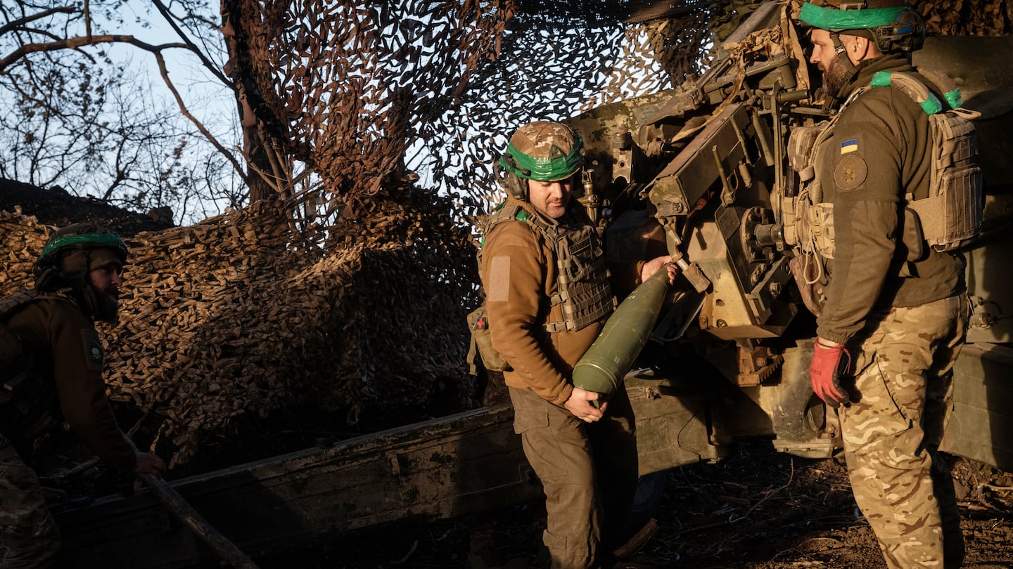 Ukrainian National Guard soldiers with an artillery battery of the 15th Brigade prepared to fire a shell in the Donbas region of Ukraine on Oct. 1.