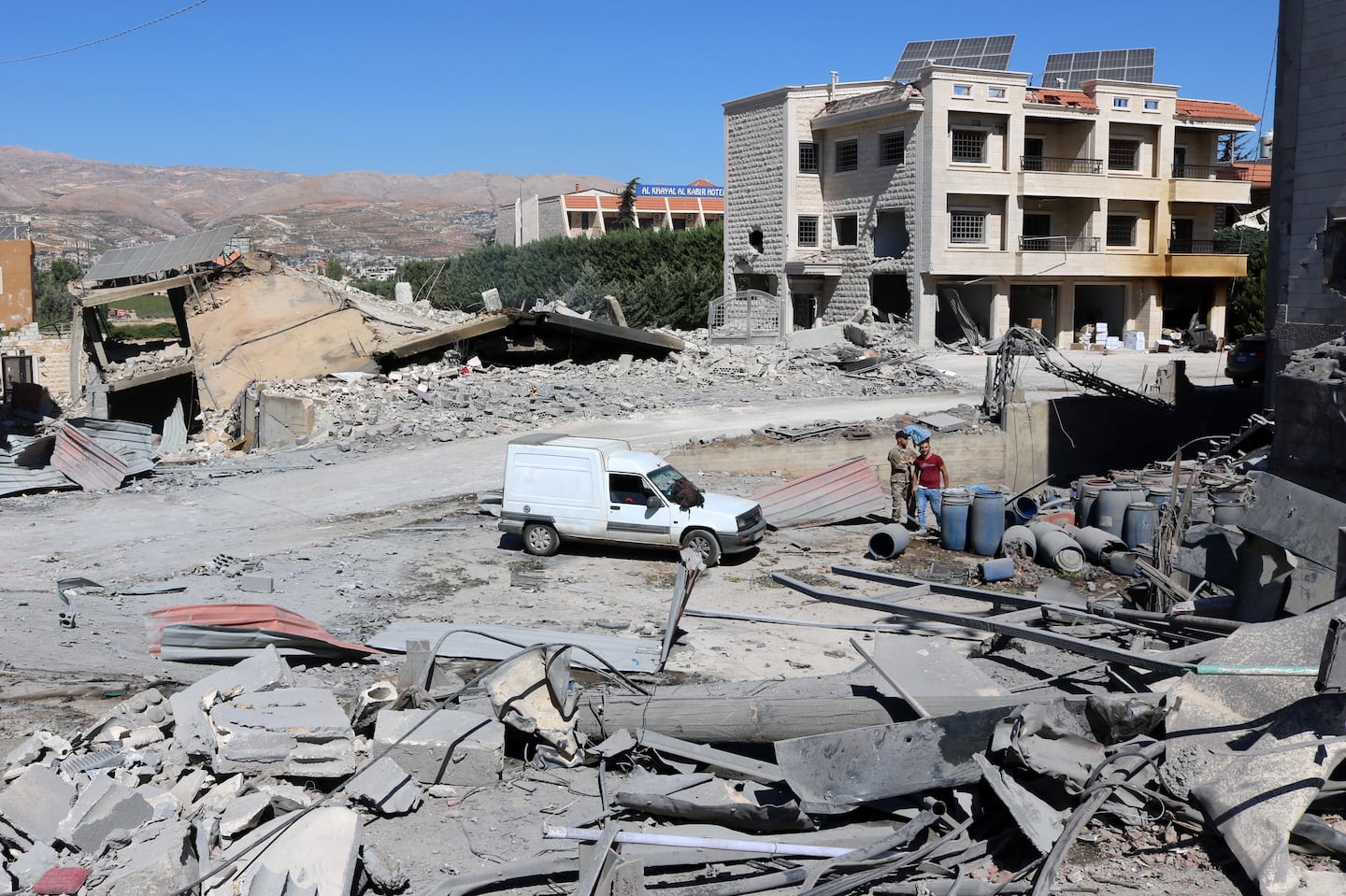 People check the destruction at the site of an Israeli overnight airstrike that targeted a house in the town of Ablah in Lebanon's Bekaa valley on Oct. 5.