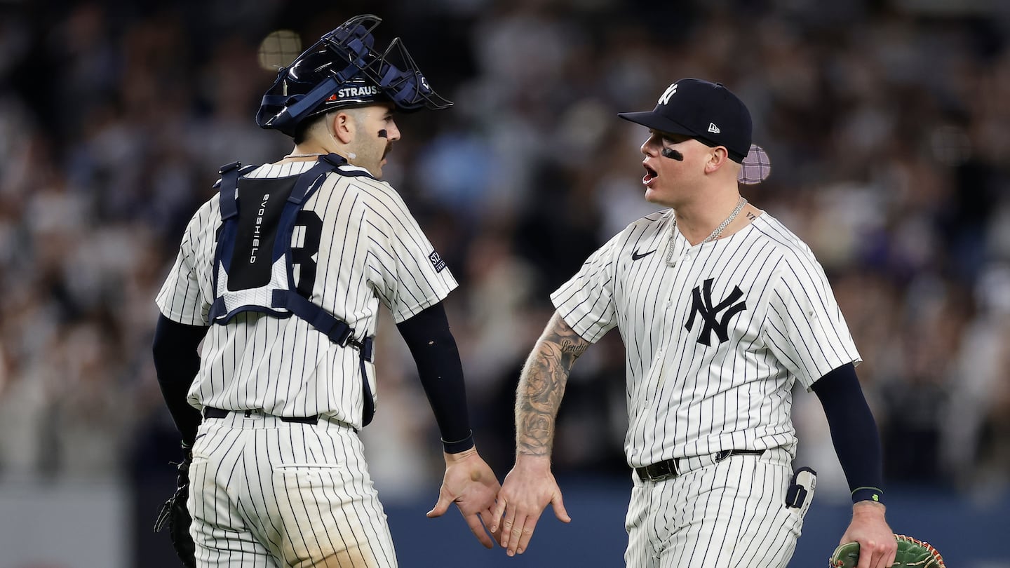 Yankees catcher Austin Wells (28) and outfielder Alex Verdugo celebrate after taking Game 1 over the Royals Saturday night at the Stadium.