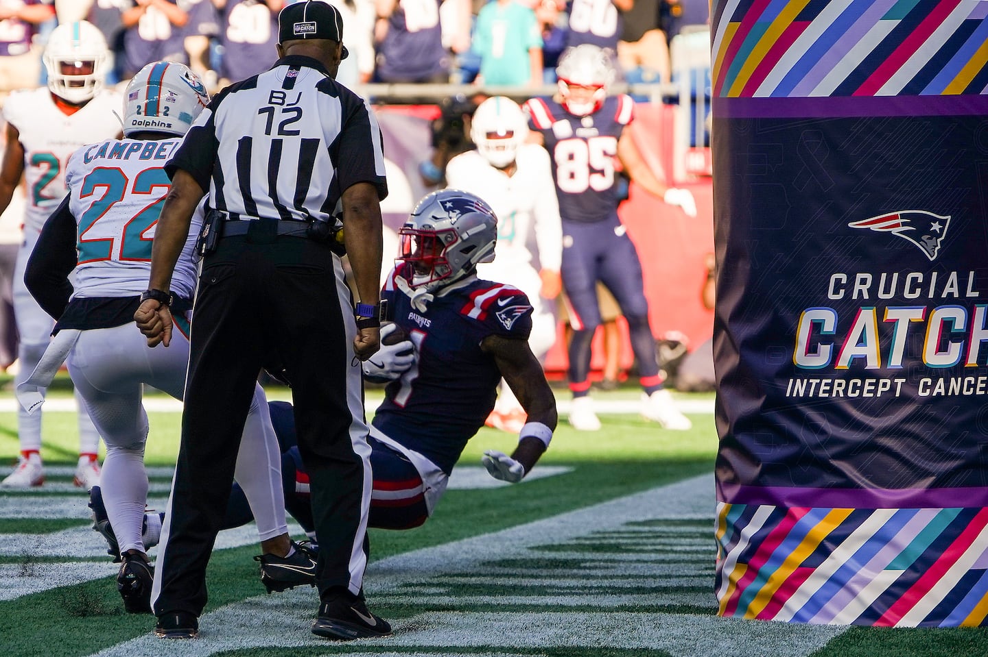 For a moment, it appeared Ja'Lynn Polk had won Sunday's Patriots game over the Dolphins with a touchdown catch just inside the end line. Replay, however, determined his foot touched out of bounds.