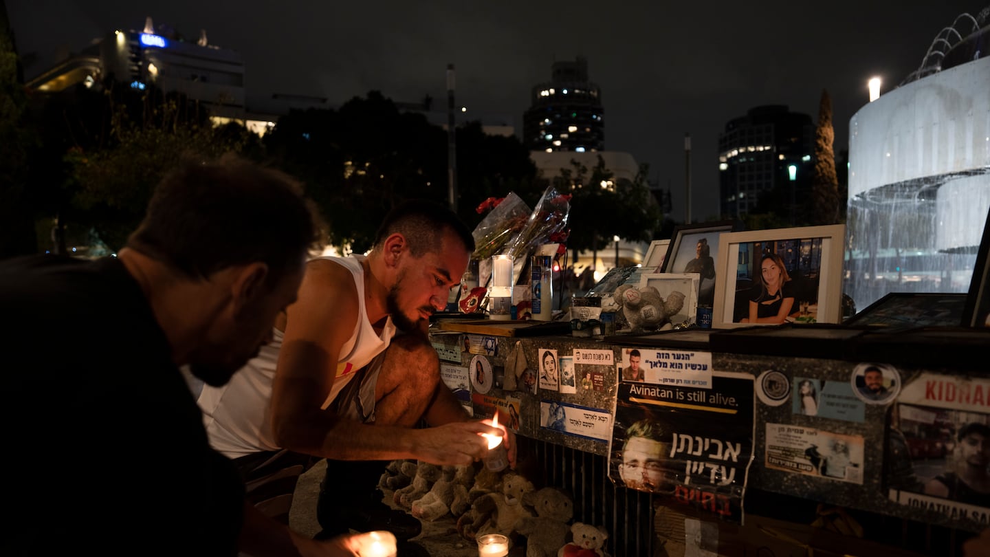 People light candles at a memorial for the victims of the Oct. 7 Hamas cross-border attack on Israel, on the eve of the one-year anniversary of the attack, in Tel Aviv, Israel, on Oct. 6.