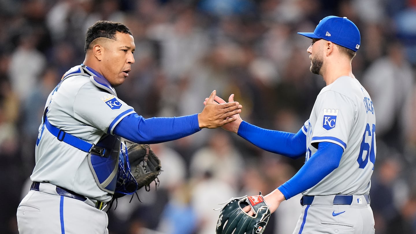 Royals pitcher Lucas Erceg (right) celebrates with Salvador Perez after beating the Yankees in New York on the strength of a four-run inning.