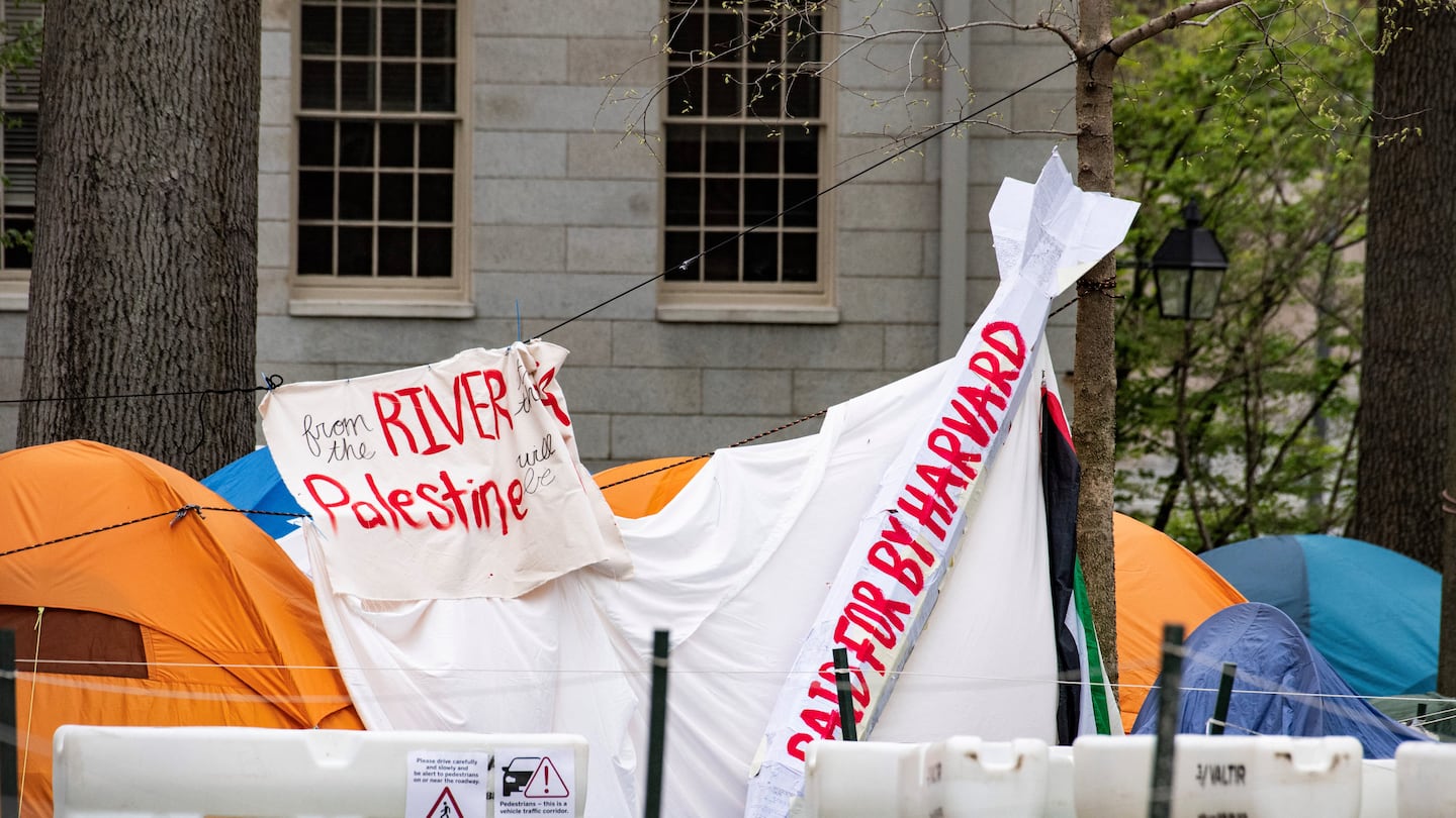 Tents and signs filled Harvard Yard by the John Harvard statue in the pro-Palestinian encampment at Harvard on May 5.