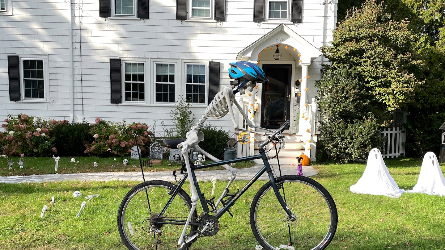 A skeleton rode a bike over another skeleton outside the Rockwoods' home in Needham last year.