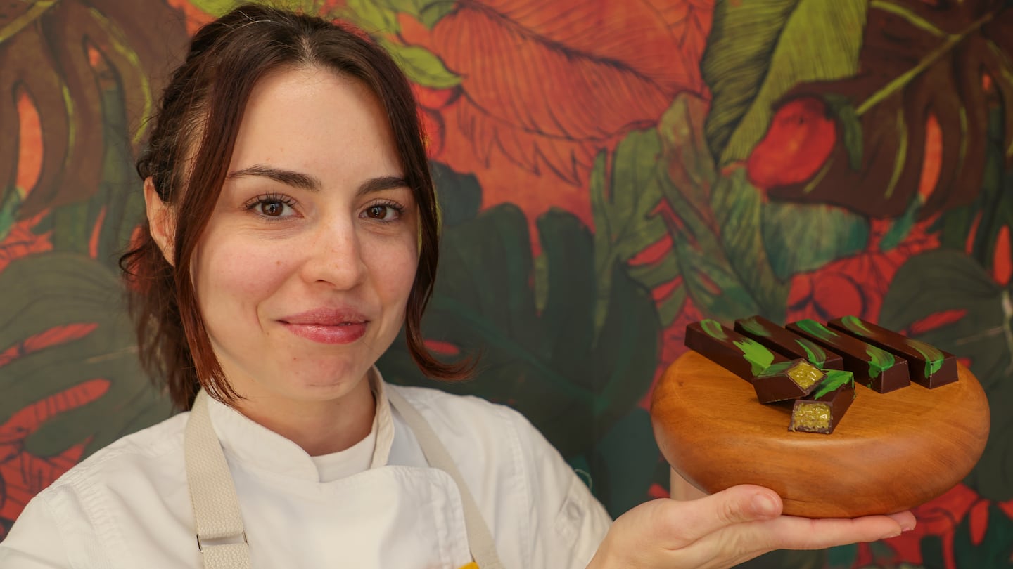 Betty Petrova, owner of Petrova Chocolates in East Boston, displays her handmade version of the viral Dubai chocolate bar.