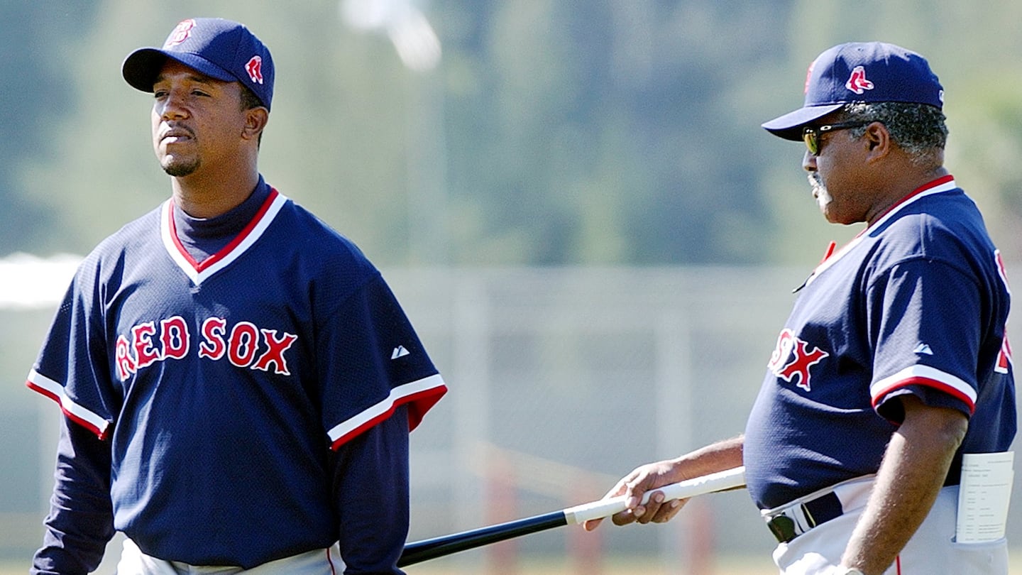 Luis Tiant (right) jokes with Pedro Martinez during spring training in Fort Myers, Florida, in February 2002. Tiant died Tuesday at the age of 83.