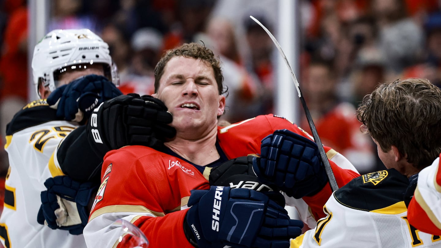 Bruins Brandon Carlo (left) and Trent Frederic both tried to get at Florida's Matthew Tkachuk, but Tkachuk was not interested in engaging them.