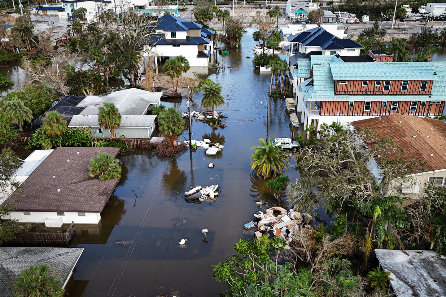 A drone image shows a flooded street due to Hurricane Milton in Siesta Key, Fla.