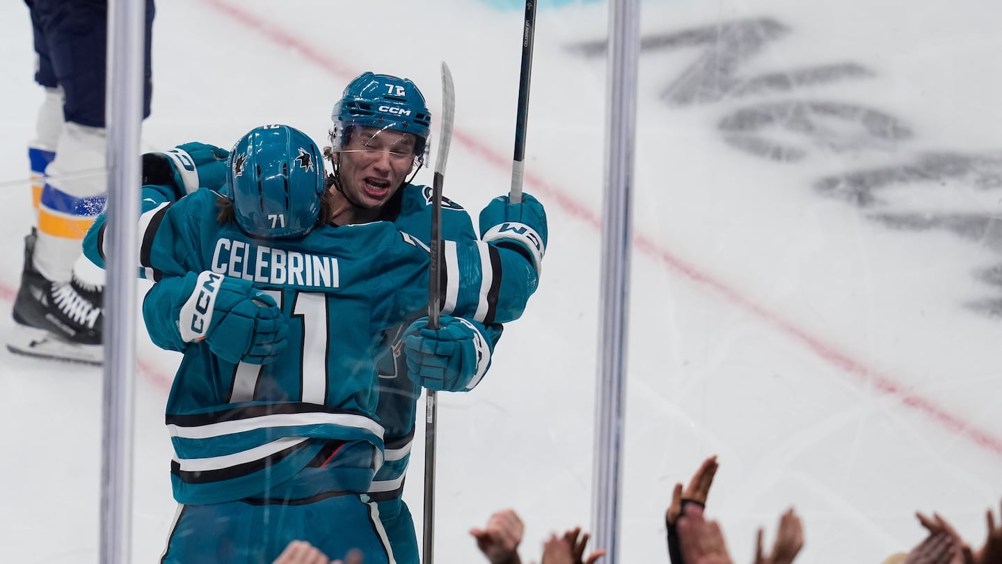 Sharks rookie center Macklin Celebrini is congratulated by left wing William Eklund after his first NHL goal.