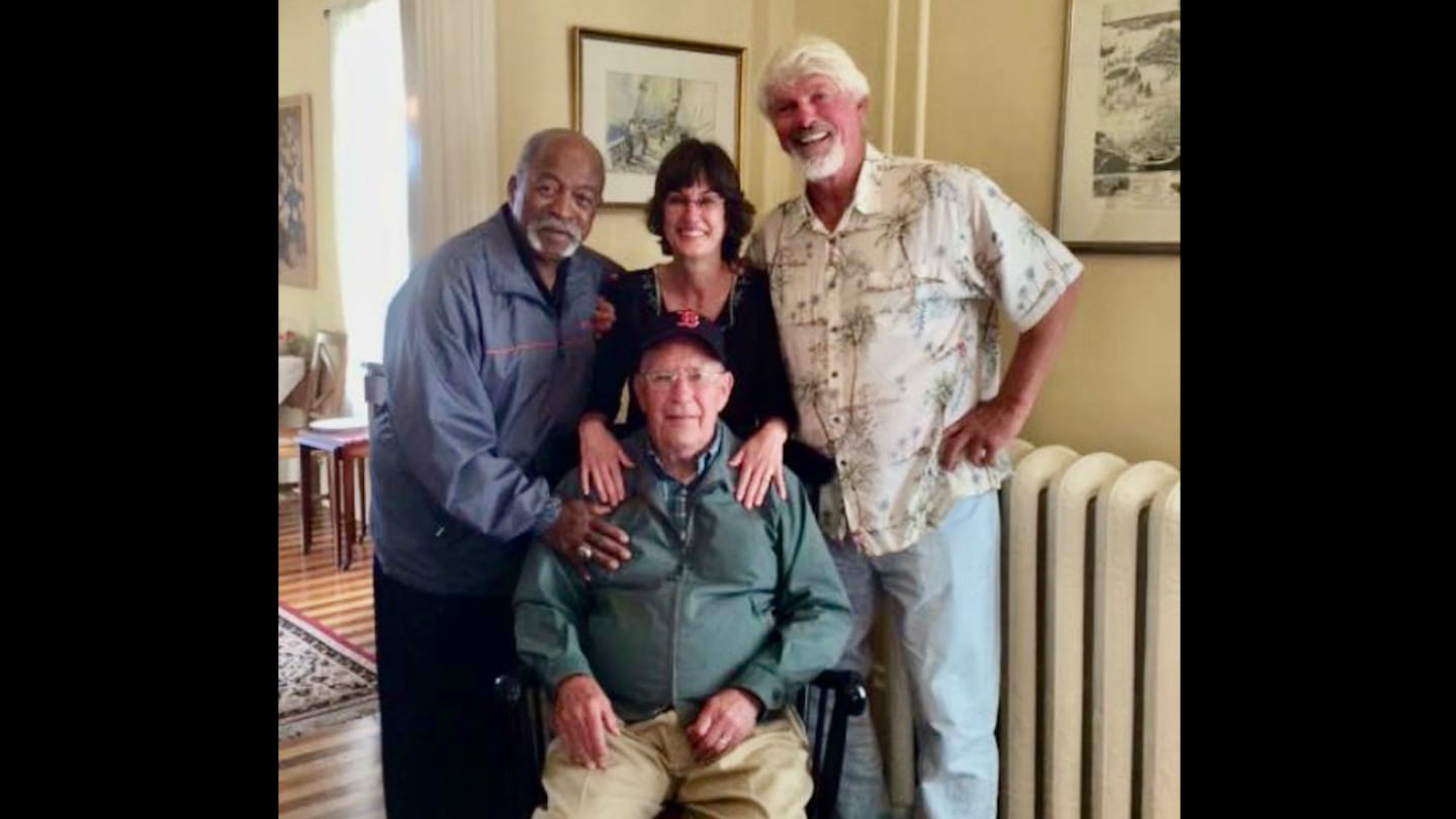 Luis Tiant, Lynda Wallace Merullo, Bill Lee, and Richard Wallace (seated) posed for a photo in 2015.