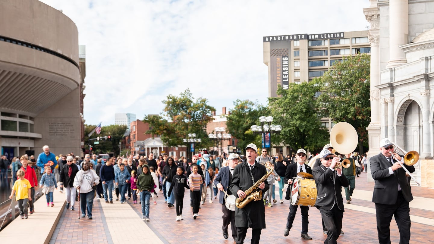 Hot Tamale Brass Band leads the children's parade at the end of the Opening Our Doors kickoff at Christian Science Plaza in 2023.