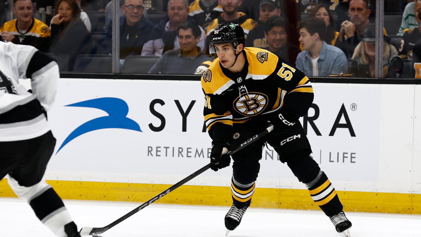 BOSTON, MA - OCTOBER 12: Matt Poitras #51 of the Boston Bruins carries the puck against the Los Angeles Kings during the first period at TD Garden on October 12, 2024 in Boston, Massachusetts. (Photo By Winslow Townson/Getty Images)