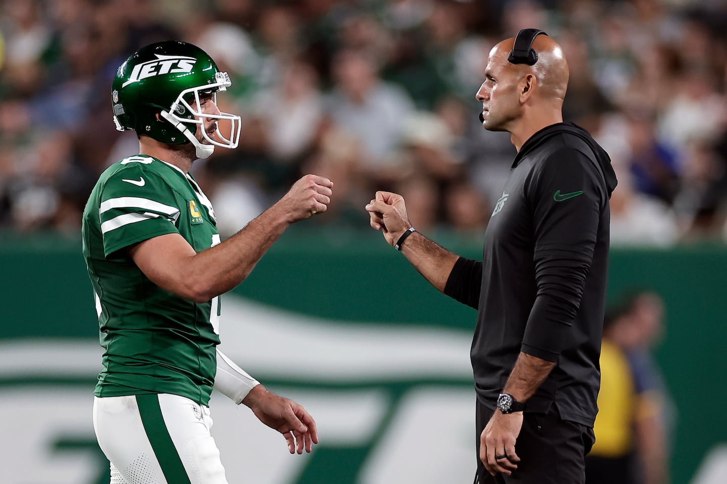 Life was good for Aaron Rodgers (left) and Robert Saleh during the Jets' Week 3 win over the Patriots, but the quarterback denied involvement in the coach's recent firing.