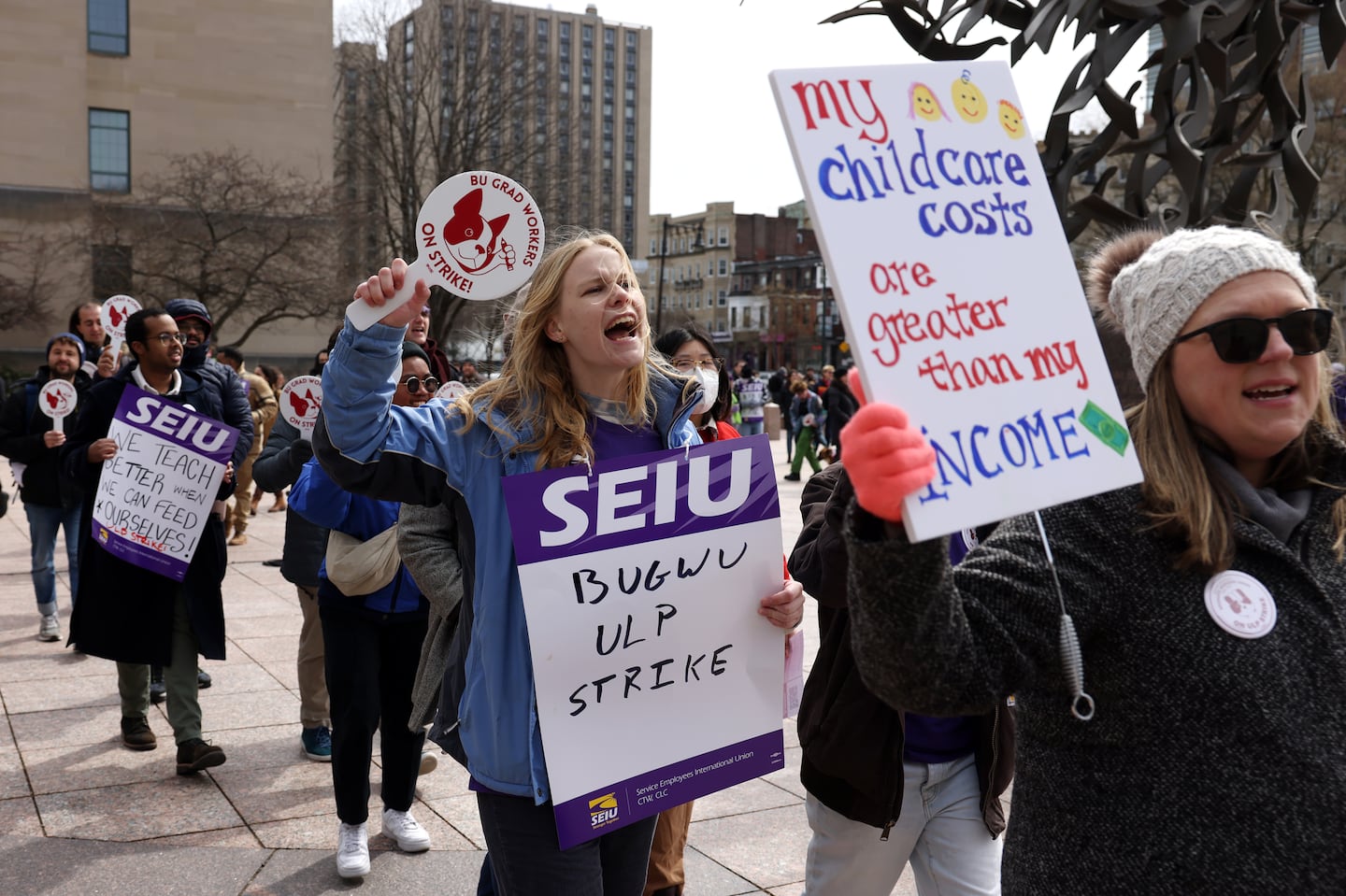 Anne Curtis, a graduate student at Boston University (center), rallied along with fellow grad students and allies as BU graduate worker students went on strike for fair pay, better health care coverage, and stronger benefits.