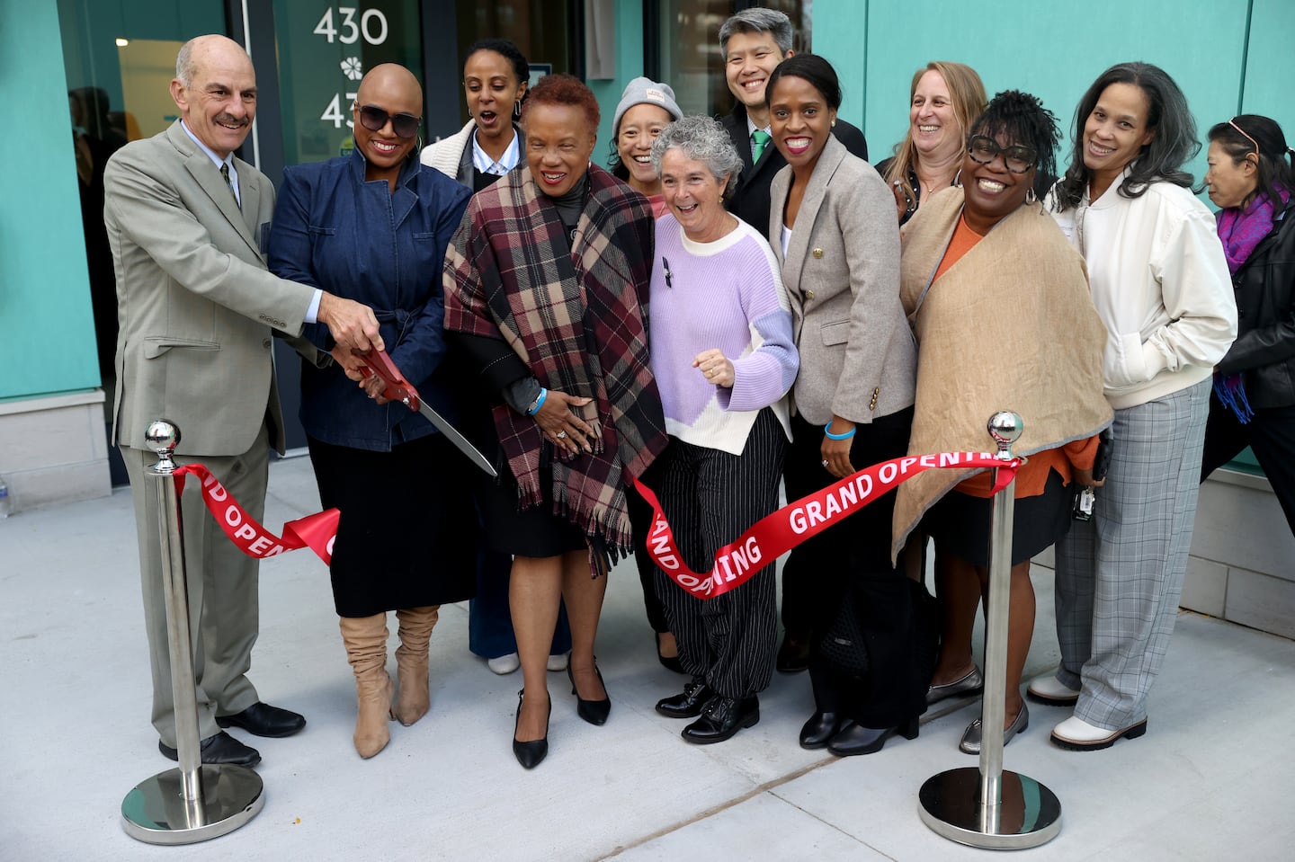 Just A Start celebrated on Oct. 10 the grand opening of the Economic Mobility Hub at Rindge Commons, a new 70,000-square-foot facility designed to meet the evolving needs of the Cambridge community. Carl Nagy-Koechlin, left, executive director at Just A Start, cut the ribbon.