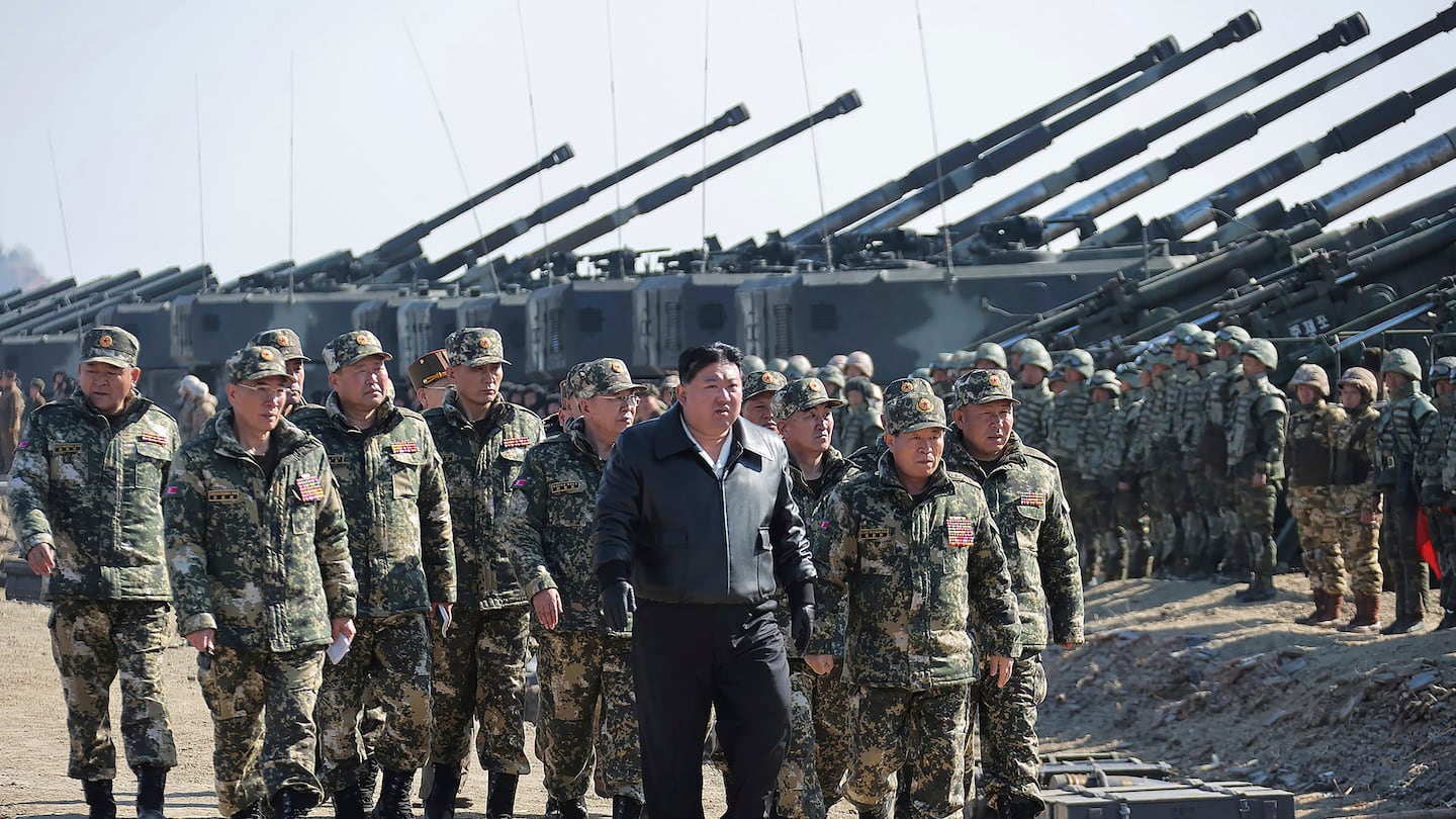 In this photo provided by the North Korean government, North Korean leader Kim Jong Un, center, supervises artillery firing drills in North Korea on March 7.