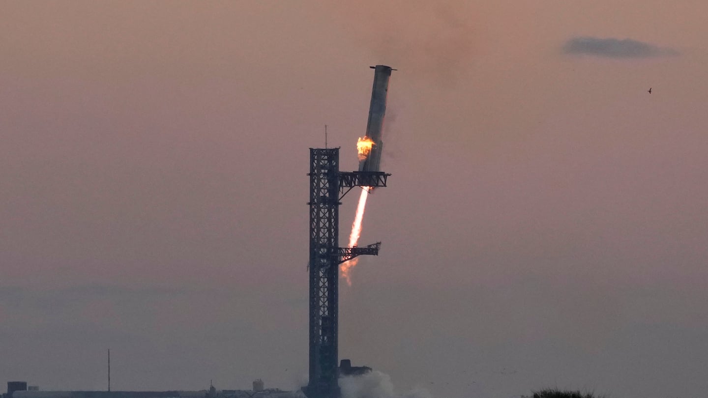 SpaceX launched and returned a rocket booster to its Texas site, catching it with mechanical arms in its first-ever “chopsticks” landing.