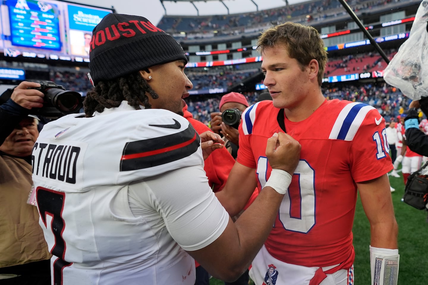 Texans QB C.J. Stroud (left) had some words of encouragement for Drake Maye (right) after Maye's first NFL start.