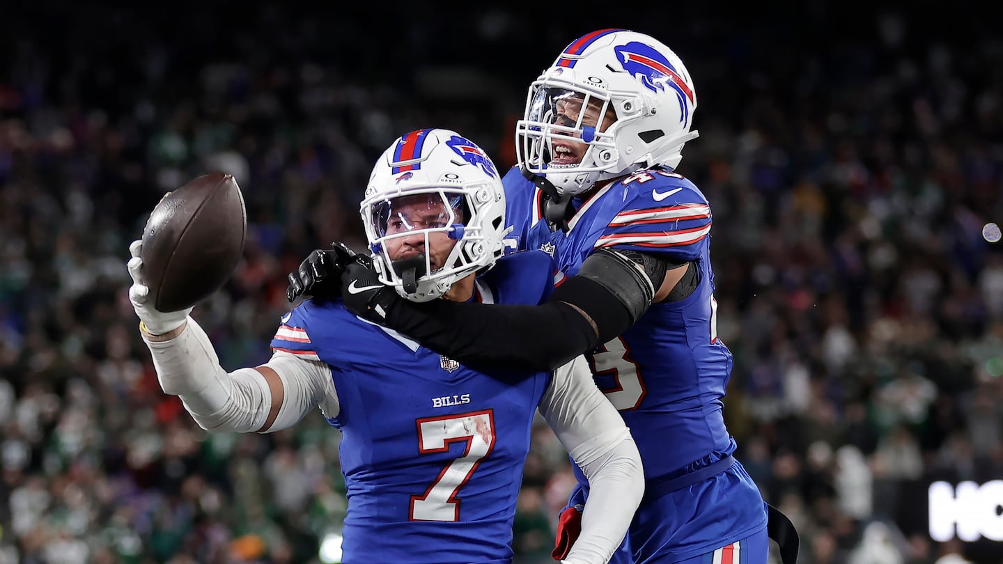 Bills cornerback Taron Johnson (left) was congratulated by teammate Terrel Bernard after intercepting a pass during the second half.