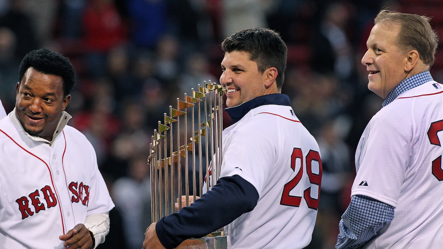 Keith Foulke (center, flanked by Pedro Martinez and Curt Schilling in 2018) played just three of his 11 major league seasons with the Red Sox but says 2004 "defines my career."