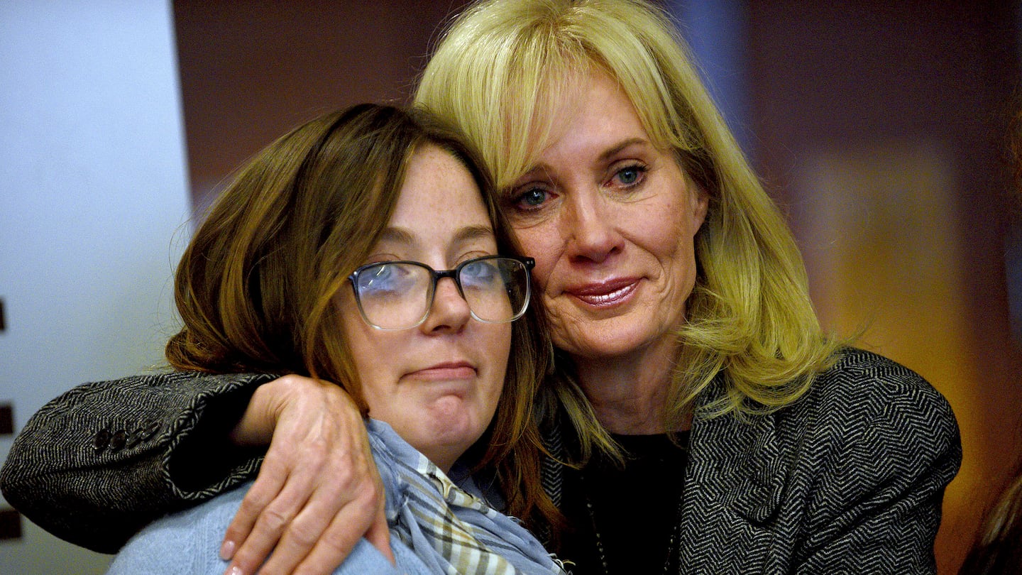 Alexandra Eckersley, who was convicted on charges that she abandoned her newborn in the woods, hugs her mother, Nancy Eckersley, after her sentence was suspended at a hearing at Hillsborough County Superior Court in Manchester, N.H., on Thursday, Oct. 17, 2024.