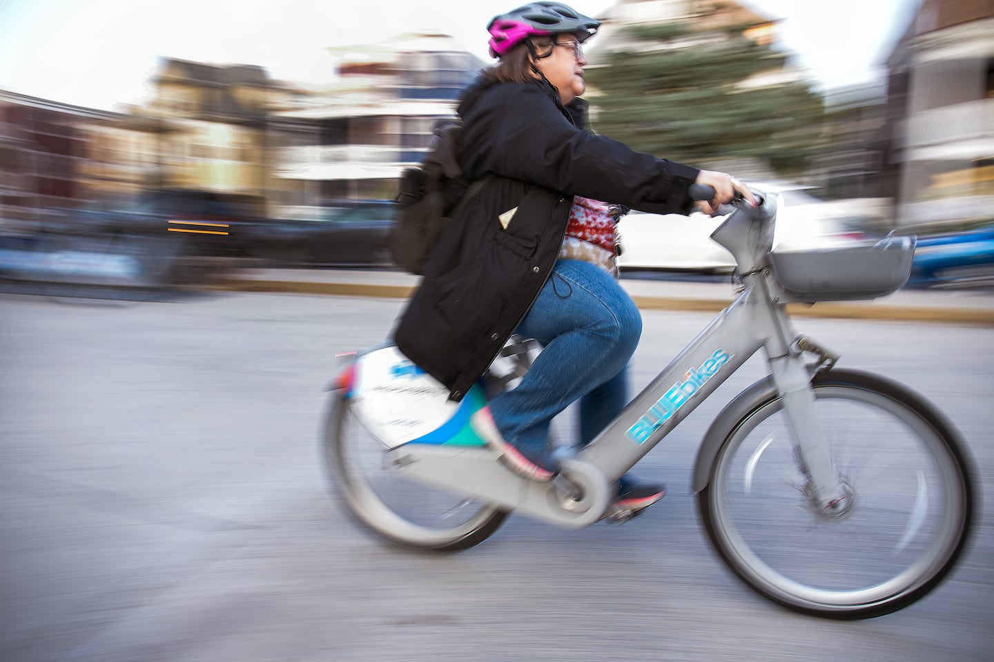 Molly Jennings picked up an e-bike at the Shawmut MBTA Station on her way home from work.