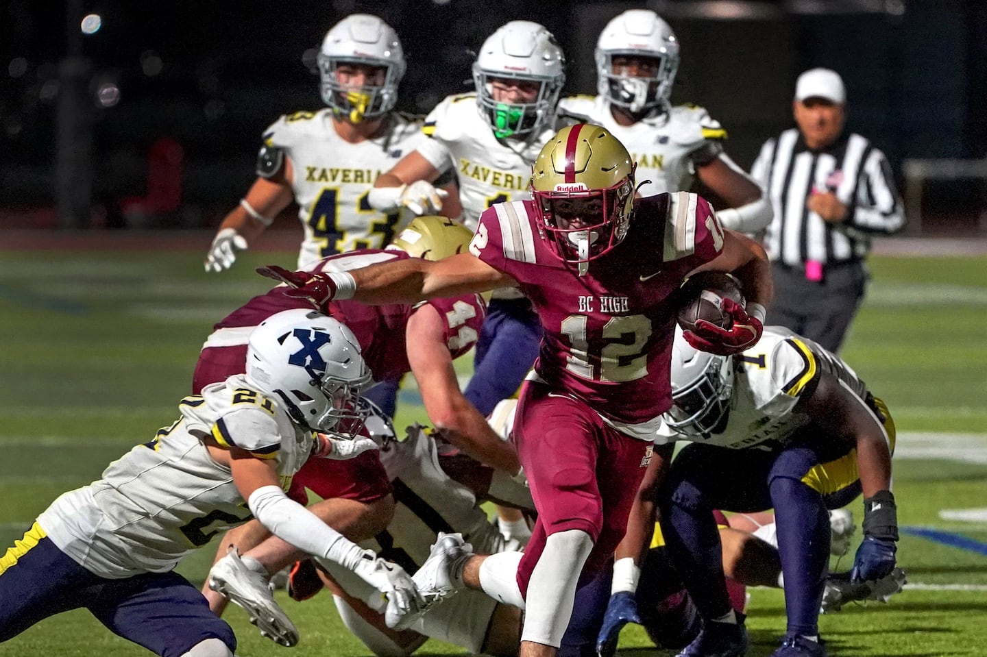 BC High’s Jackson Richard breaks loose for a long run as BC High downed Xaverian, 30-13.