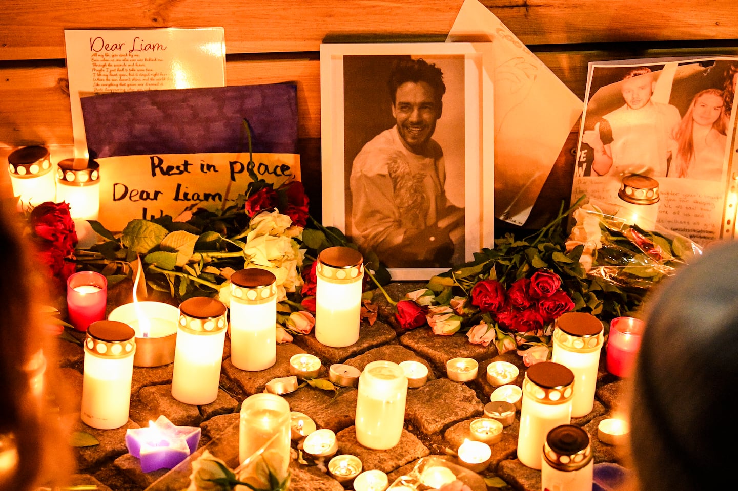 Fans gather for a vigil to pay tribute to late British singer Liam Payne, former member of the British pop band One Direction, outside the music studio where One Direction recorded their first two albums, in Stockholm, Sweden, Saturday, Oct. 19, 2024.