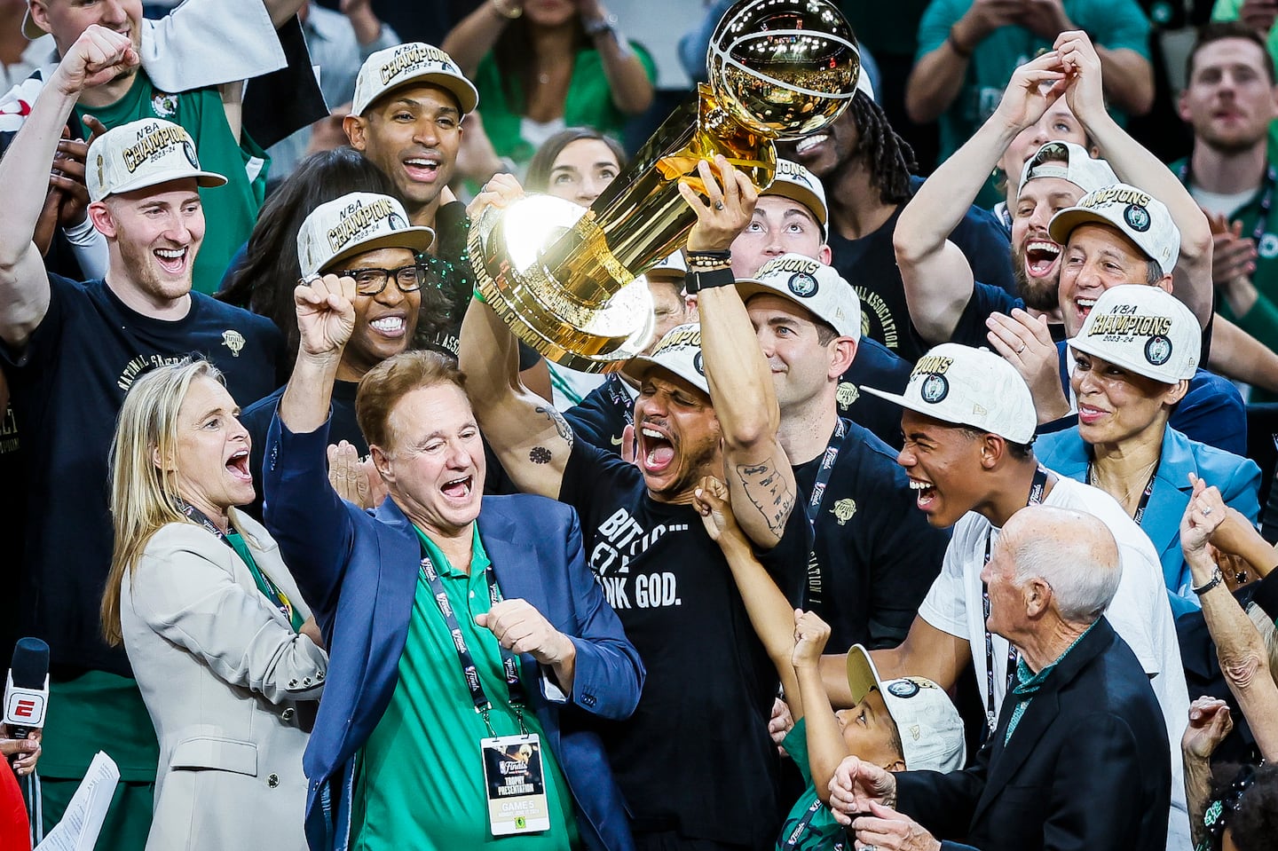 The last thing Celtics coach Joe Mazzulla (hoisting the Larry O'Brien Trophy) wants his team to think about after the banner gets lifted on Tuesday night is last season.