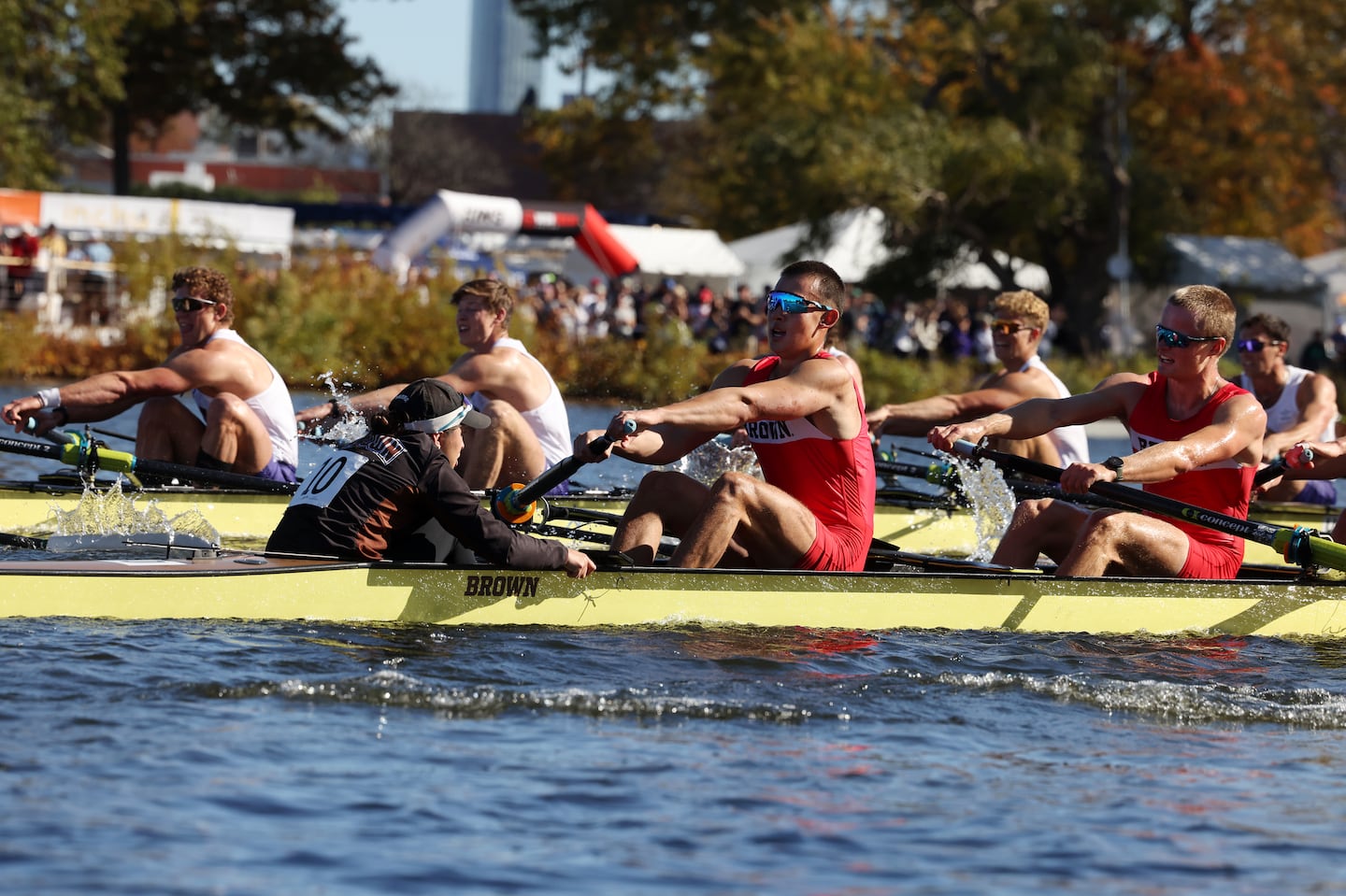 Rowers from Brown University (Front) and University of Washington battled against each other in the Men’s Championship Eights at the Head of the Charles.