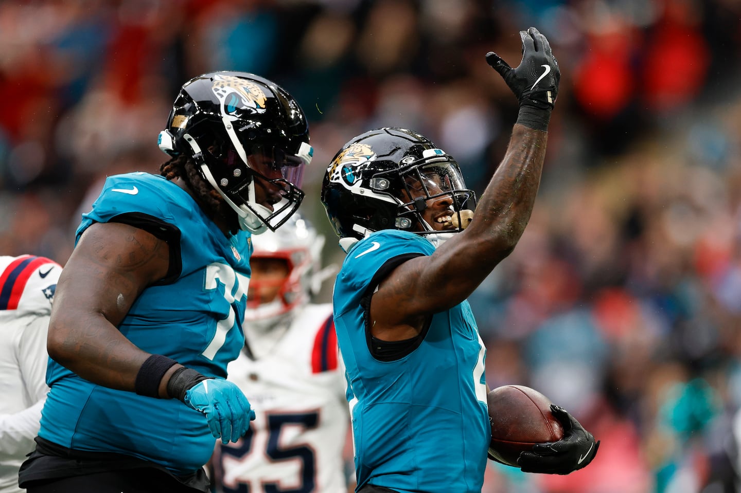 Jaguars running back Tank Bigsby (right) rushed for 118 yards and two touchdowns.