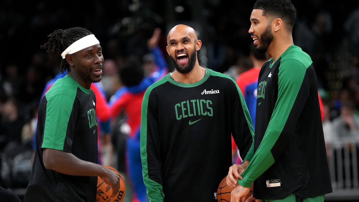 Jrue Holiday (left), Derrick White (center), and Jayson Tatum open the new season on Tuesday when the Celtics host the Knicks at TD Garden.