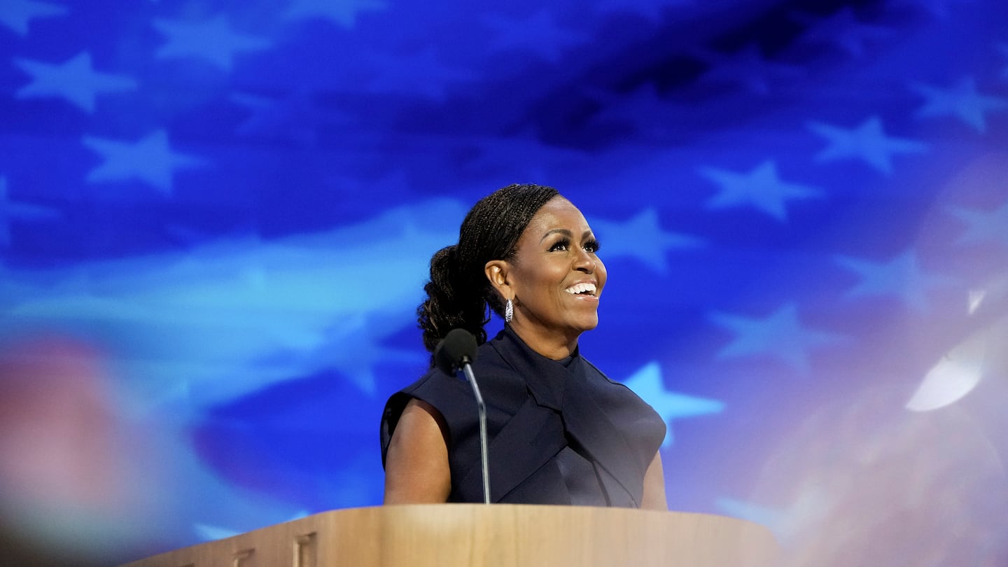 Former first lady Michelle Obama at the Democratic National Convention in August, where she urged a revved-up crowd to "do something" to ensure that Vice President Kamala Harris is elected the country's 47th president.