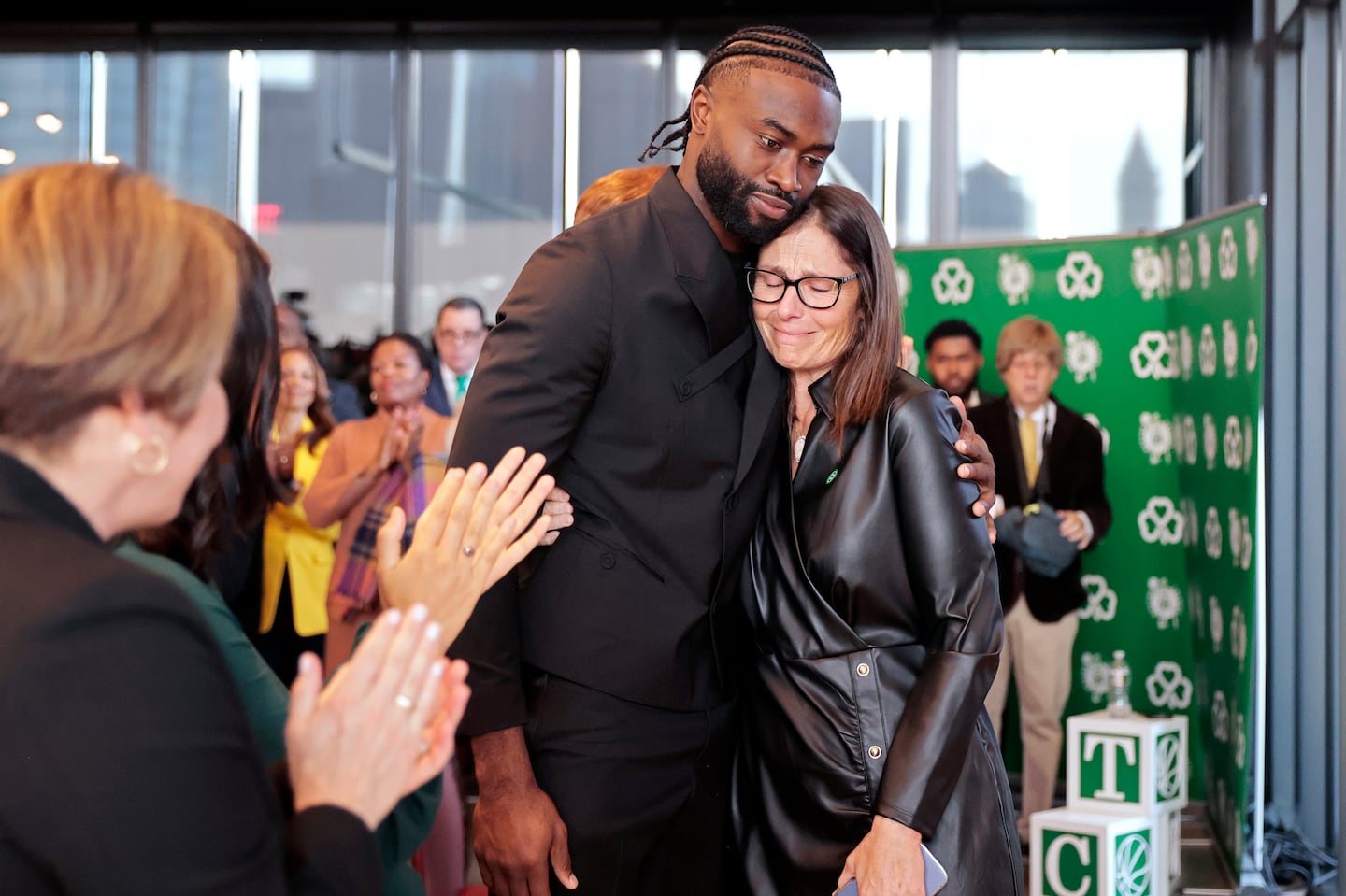 Celtics player Jaylen Brown embraced Jeannine Russell after she gave tearful remarks about her late husband Bill Russell during a news conference Monday. The North Washington Street Bridge will be renamed as the William Felton “Bill” Russell Bridge.