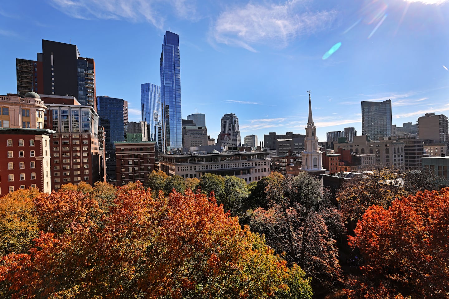 A view of the top of colorful trees at the Granary Burying Ground in Boston in November 2022.