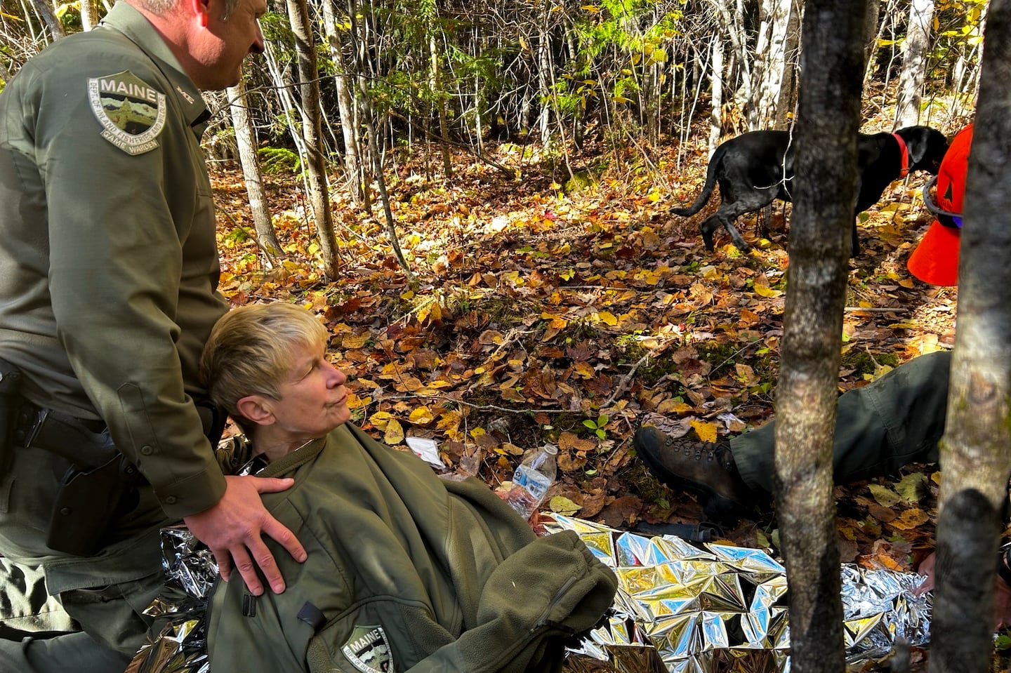 Pamela Helmstadter, 72, was carried by Maine game wardens rescuing her from the woods about a mile from her home.