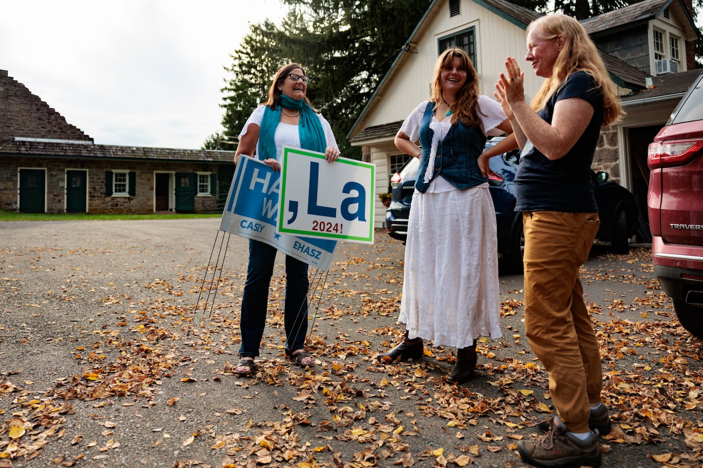 Utah residents Cherise Udell, 57, and her daughter Ella Udell, 18, delivered signs to Betsy Rivinus Denny in New Hope, Pa., in support of Vice President Kamala Harris on Sept. 30.