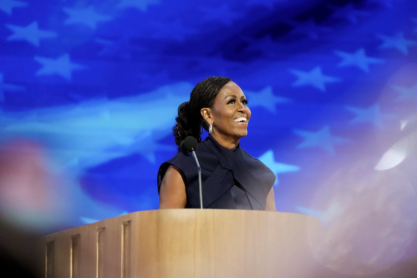 Former first lady Michelle Obama at the Democratic National Convention in August, where she urged a revved-up crowd to "do something" to ensure that Vice President Kamala Harris is elected the country's 47th president.