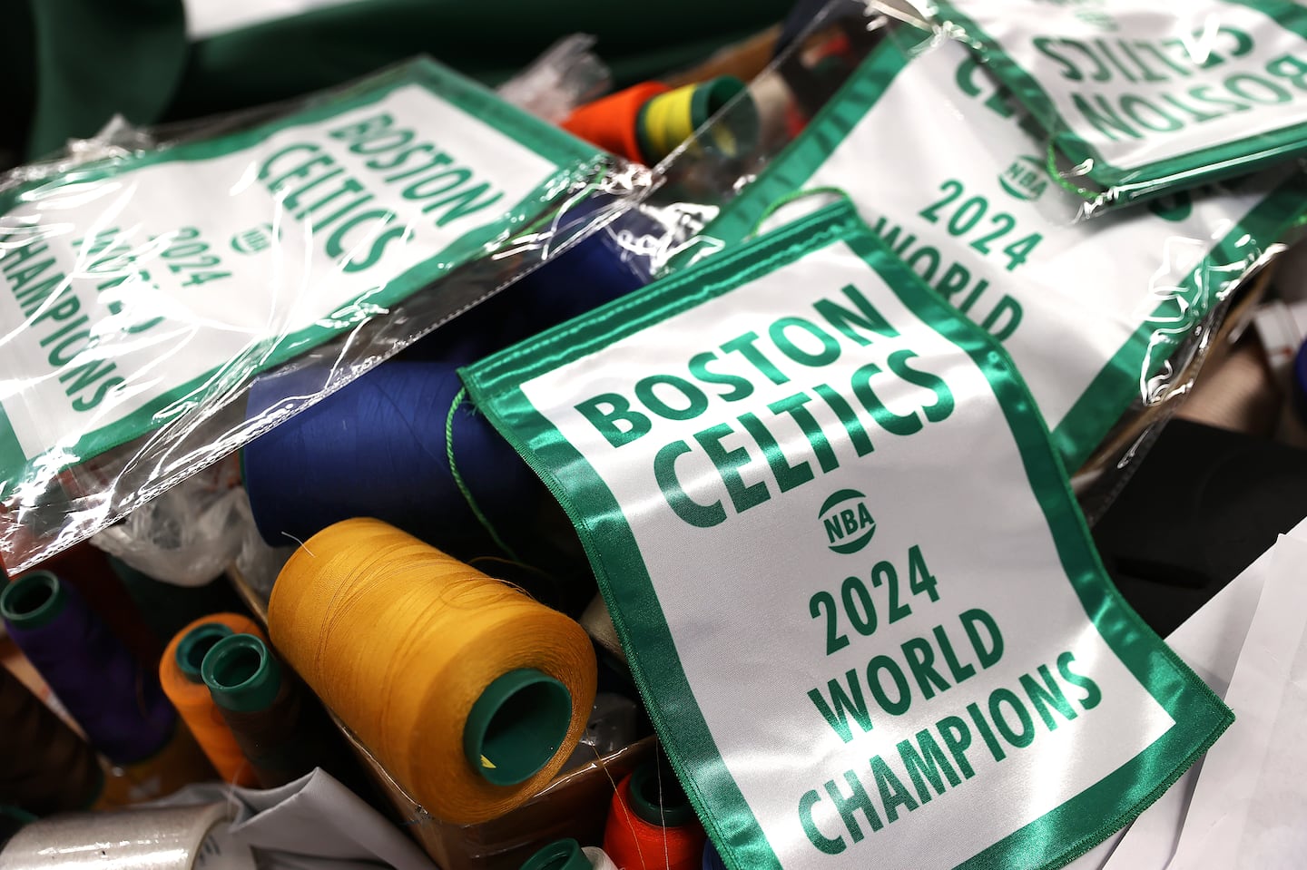 Replicas of the 2024 Celtics banner are on display in the Woburn workshop that's home to New England Flag and Banner.