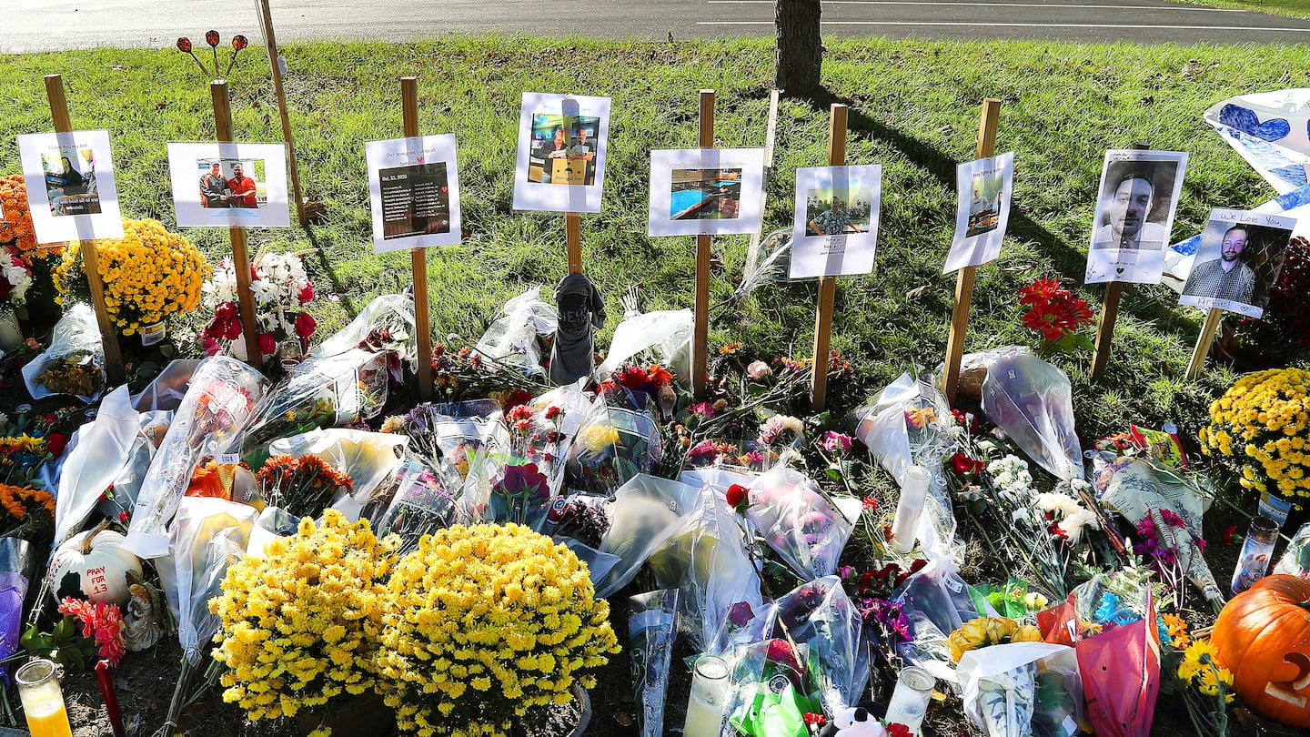 A makeshift memorial at Schemengees Bar and Grille in Lewiston, Maine, on Nov. 3, 2023, had photos of the victims.