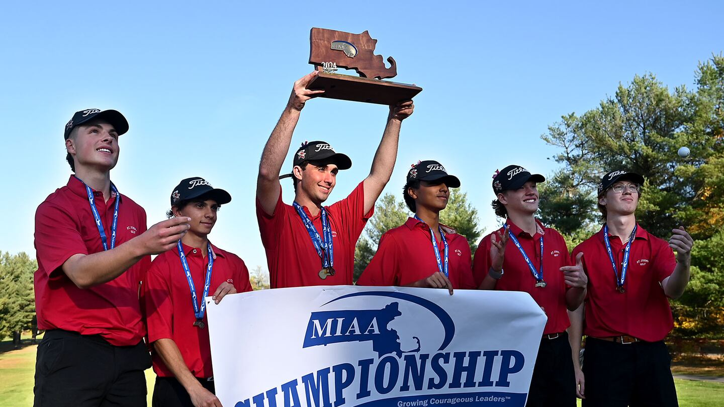 Senior Ronan Mooney, surrounded by his St. John's (Shrewsbury) teammates (from left) Cael Duggan, Adam Trani, Savar Bhasin,  Andrew Marrone, and Derek Mulligan, holds aloft the Division 1 state championship trophy after Mooney led the Pioneers to a second consecutive crown Monday at The Haven Country Club in Boylston.