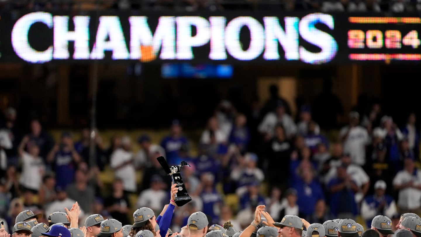 Members of the Dodgers celebrates their National League Championship Series clincher on Sunday in Los Angeles.