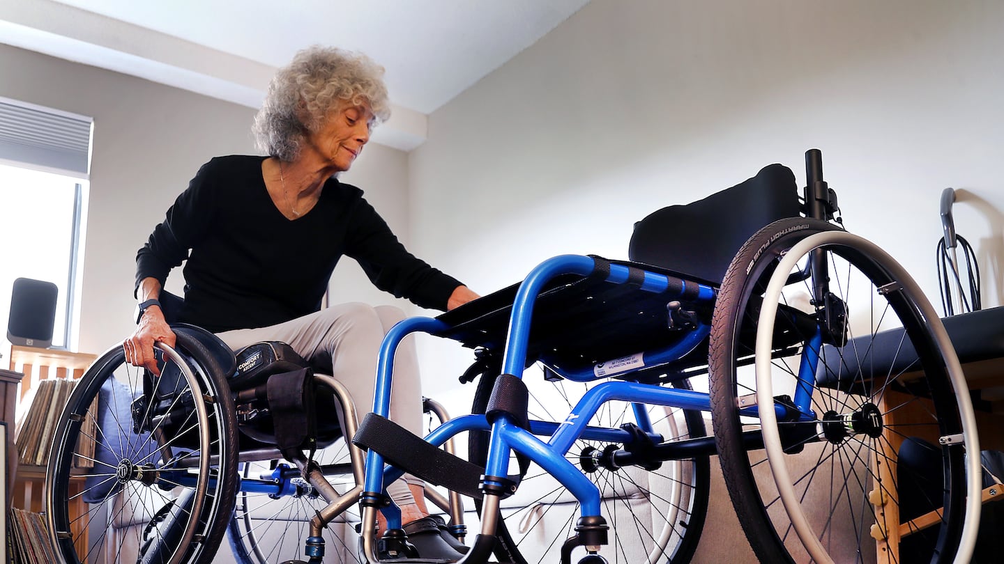 Jackie Miller waited months to get a new wheelchair (right) to replace the 9-year old one she currently uses. When she got it, parts started falling off.