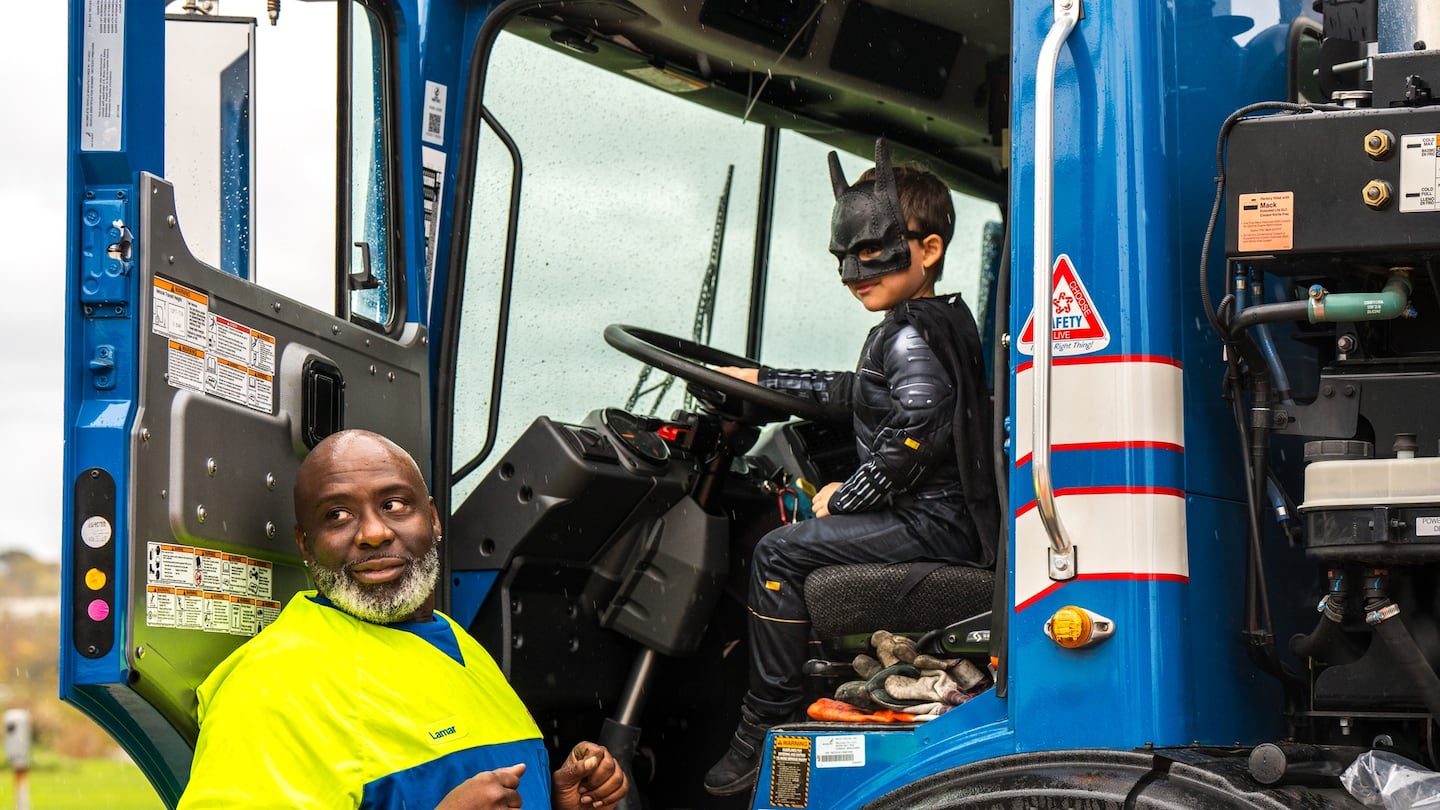 "Batman" behind the wheel of a truck at a previous Touch-a-Truck event.