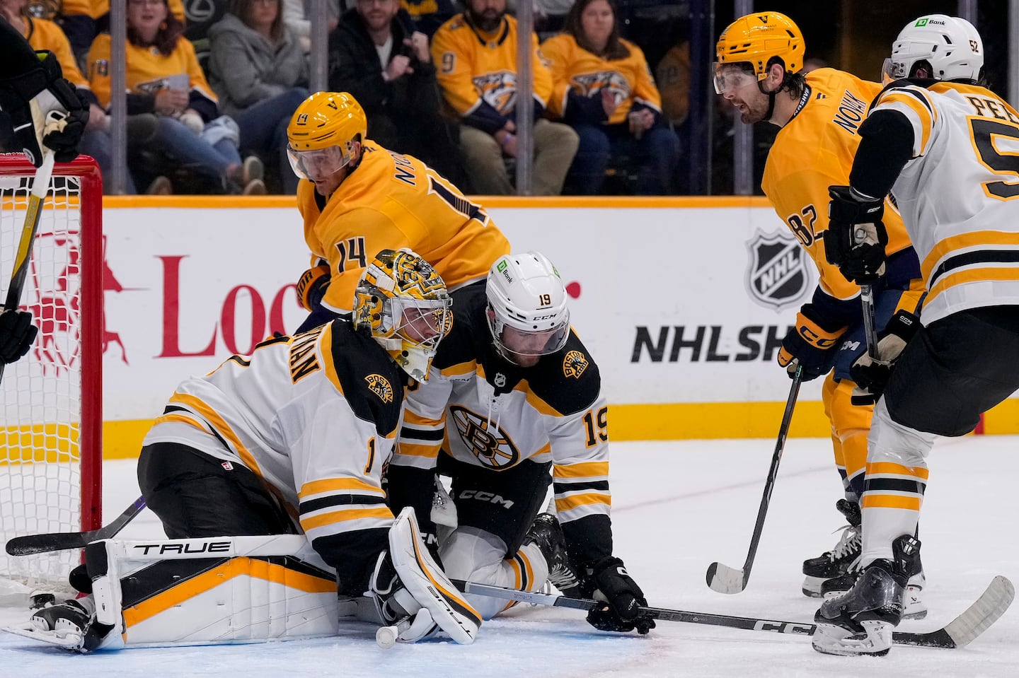 Johnny Beecher dropped in to help Bruins goalie Jeremy Swayman at the edge of the the crease, but the Predators' Tommy Novak (82) converted for the game's second goal nonetheless.