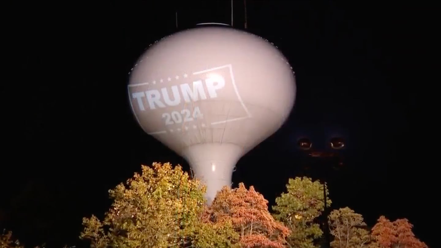 A Trump 2024 logo was projected onto a water tower in Hanson.