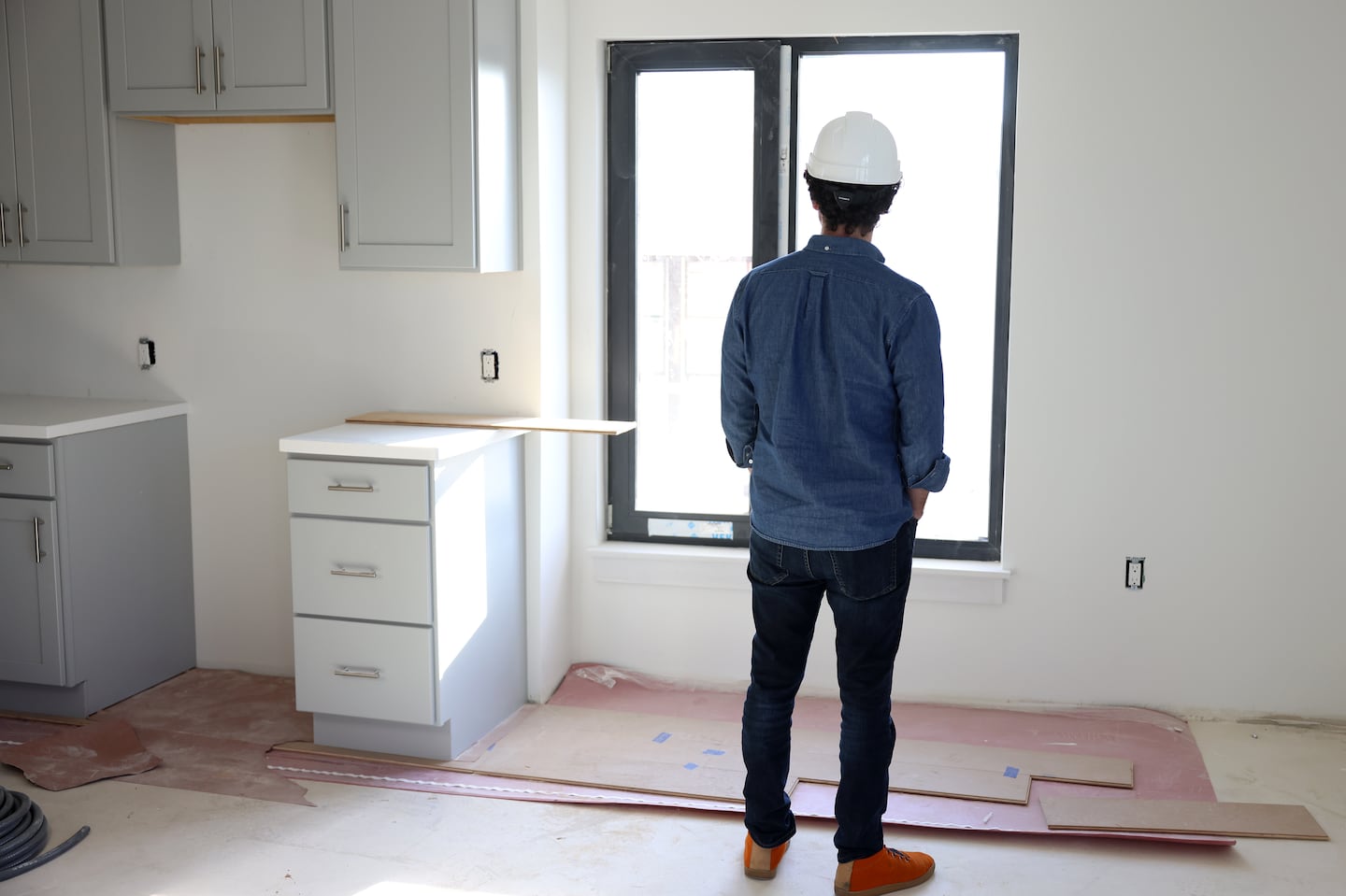 A member of a tour looked out the window as he got a look inside a unit at Brookley Flats during a tour.  The Jamaica Plain Neighborhood Development Corporation is constructing new housing that includes what’s believed to be the city’s first affordable homeownership units for first-generation buyers.